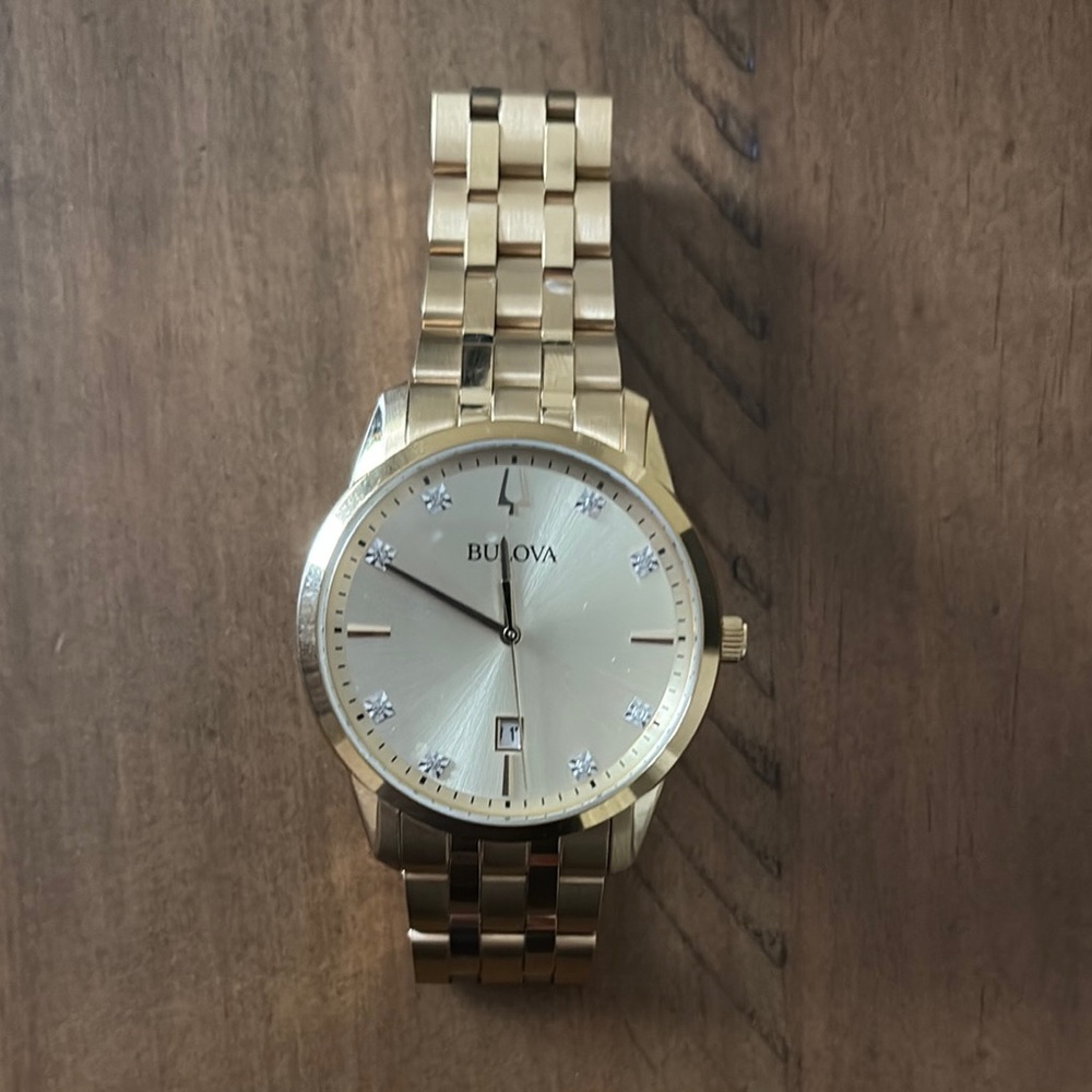 Bulova Gold Watch with Elegant Design and Minimalist Dial - sized, gently worn